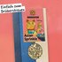 Asian Sprinkle Gewürz in der Packung mit Sichtfenster und Illustration einer winkenden Katze.